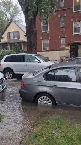 Cars Navigate Flooded Streets in Chicago Suburb