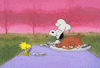 Peanuts gif. Snoopy wears a chef's hat and carves a large turkey and takes a bite, standing at a table outside with Woodstock.