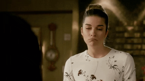 Schitt's Creek gif. Annie Murphy as Alexis looks to the side lips pursed, considering, saying, "Ok."
