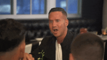 Reality TV gif. Mike from Jersey Shore Family Vacation pulls back from the table with his jaw dropped, appalled at what he's heard.