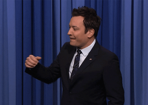 Tonight show gif. Jimmy Fallon does a low fist pump and bites his lip in excitement.