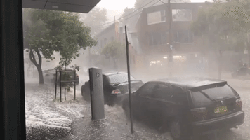 Streams of Hail Flow Down Street as Storms Hit Sydney