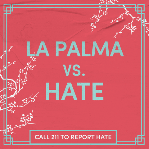 Text gif. Sage green letters on a coral background, surrounded by swaying cherry blossom branches as a butterfly glides through. Text, "La Palma vs hate, call 211 to report hate."