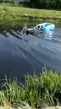 Two Lads Row Inflatable Pool Down Scotland's Clydebank Canal