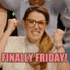 Video gif. Seated in a cheering audience, an intense young woman with large glasses claps along, then shouts like she's doing a battle cry. Pastel cartoon sparkles float around her. Rainbow flashing text, "Finally Friday!"