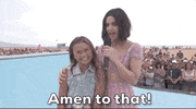 TV gif. Standing on a skateboard ramp, Lucy Hale puts her arm around Sky Brown, who looks up at her eagerly, while Lucy says into a microphone, "Amen to that!" which appears as text.
