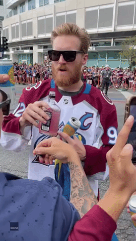 Denver Hockey Captain Shares Drinks With Crowd at Stanley Cup Parade