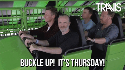 Video gif. Four men of the band Travis buckled into a green rollercoaster car, which then proceeds on the track. Text, "Buckle up! It's Thursday!"