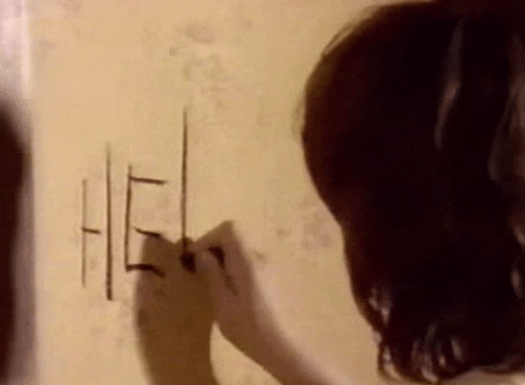 TV gif. A child in Are You Afraid of the Dark writes, "Help," in black on a stained beige wall.