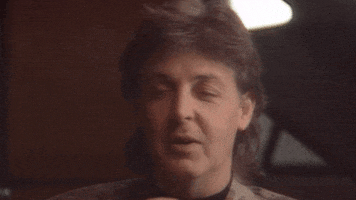 Celebrity gif. Paul McCartney holds open hands out beside his head with a shake as he glances to the side. Text, "It was this big!"