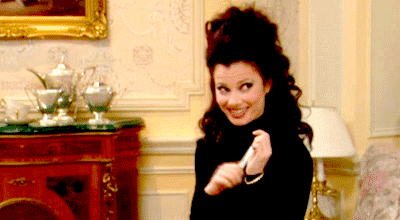 Movie gif. Fran Drescher as Fran Fine in The Nanny smiling suggestively and winking while toying with a nail file.