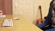 frustrated bang head on desk GIF