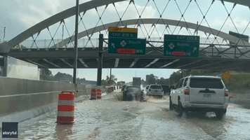 Traffic Slowed by Surface Water on Detroit Freeway