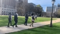 Armed Black Men Escort Michigan Lawmaker to Capitol Building