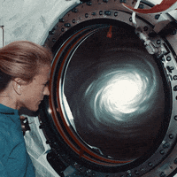 konczakowski space woman watch stare GIF