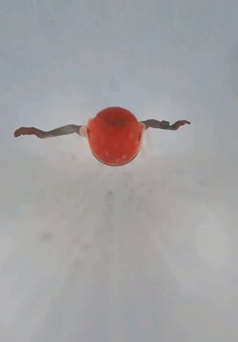 Skydiver Falling Through Cloud