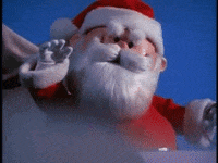 Movie gif. In Rudolph the Red-Nosed Reindeer, Santa Claus flies in his sleigh and waves heartily.