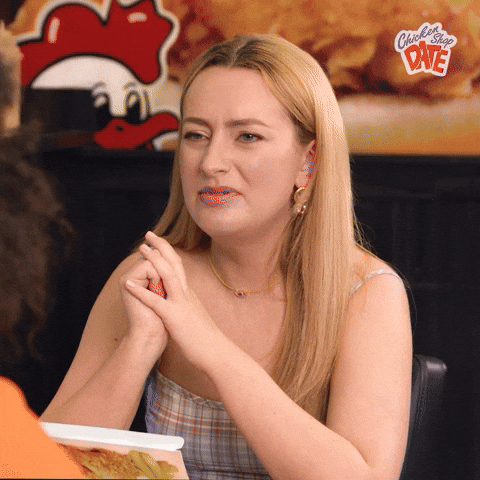 Person confused in grocery store aisle looking at keto products