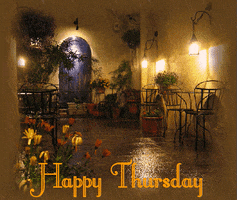 Video gif. Rain falls over an outdoor cafe lit by delicate lamps. Text, "Happy Thursday."