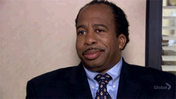 The Office gif. Leslie David Baker as Stanley gives a delicate smile and nods in approval. 