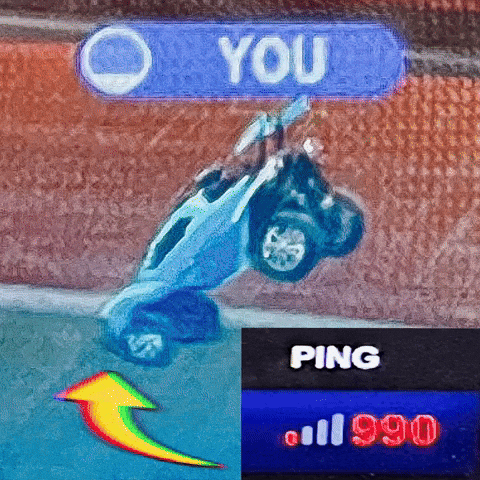 A Rocket League car flipping over with an on-screen ping indicator reading 990