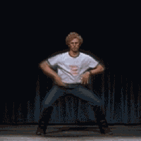 Movie gif. Jon Heder as Napoleon Dynamite crushing the talent show dance on stage.