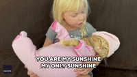 Kid Sings 'You Are My Sunshine' to Pyjama-Clad Cat