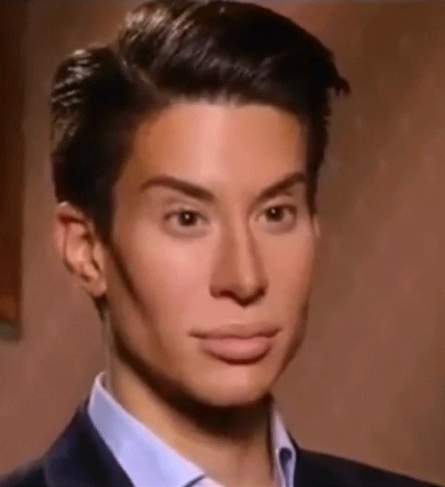 Video gif. A man gazes ahead with shocked raised eyebrows. His unmoving face contradicts with his nonstop blinking eyes.