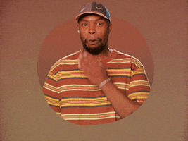 Celebrity gif. Matt Martians covers his mouth in mock-embarrassment, then shrugs it off.