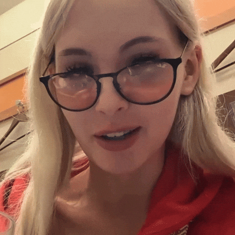 Wink Lowers Glasses GIF
