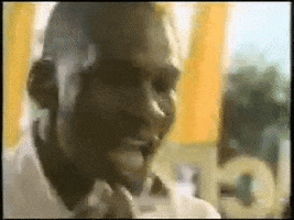 Ad gif. Michael Jordan eats a forkful of eggs at McDonald's while looking at us with wide eyes and a knowing smile.
