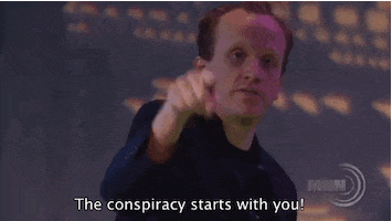 TV gif. From Conspiracy Theory Gary Show, Chris Gethard points at us and says, "The conspiracy starts with you!" which appears as text.