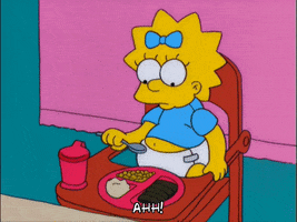 The Simpsons gif. Maggie drops her spoon on a full plate of food then holds her stomach and gasps as she wriggles in her high chair.