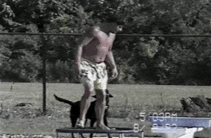 Video gif. A man jumps on a trampoline next to a pool. He slips, flopping face forward into the water in an epic fail.