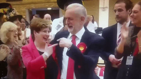 high five jeremy corbyn GIF