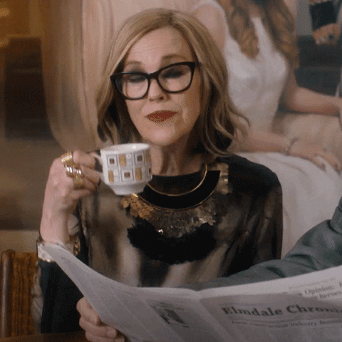 Gif of Catherine O'Hara sipping tea and saying "we love you"