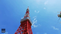 Aerobatic Aircraft Team Flies Past Tokyo Tower to Mark Start of Olympic Games