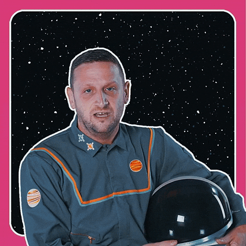 Celebrity gif. Tim Robinson in a gray astronaut suit with his helmet under his arm against a starry space background. He points his finger and looks intently while saying “if you do school people say it’s great.” Bold text reads, "School is cool!"