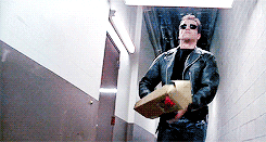 The Terminator pulling out a gun from a box of roses.