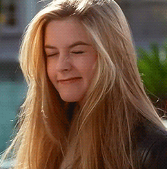 Movie gif. Alicia Silverstone as Cher in Clueless squints one of her eyes and looks up, tilting her head as if saying she doesn’t know.