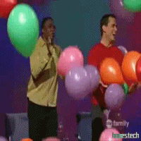 TV gif. Colin Mochrie, Ryan Stiles and Wayne Brady in Whose Line Is It Anyway? cheer and jump on stage while balloons fall from the ceiling.